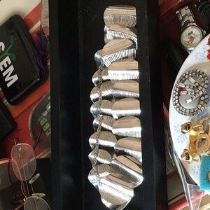 Silver colored bracelet and necklace set